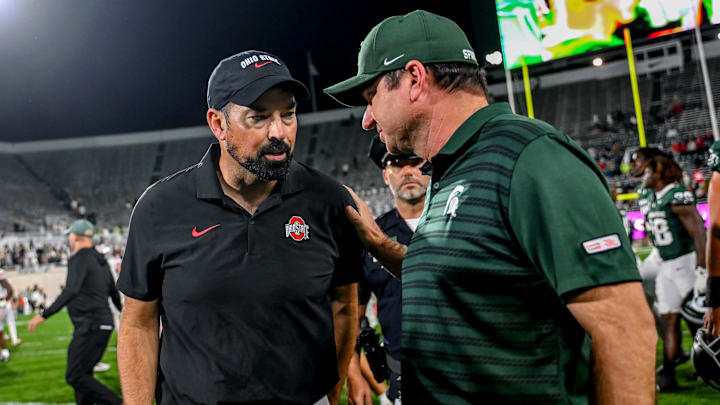 Michigan State's head coach Jonathan Smith, right, talks with Ohio State's head coach Ryan Day after the game on Saturday, Sept. 28, 2024, at Spartan Stadium in East Lansing.