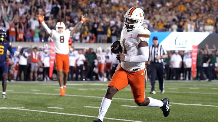 Cam Ward (1) trots in to put the Canes within a score on Saturday night against Cal. Mandatory Credit: Darren Yamashita / Imagn Images