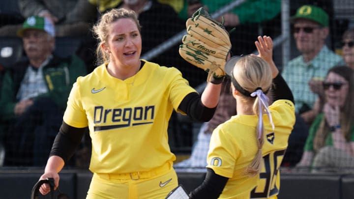Oregon’a Elise Sokolsky, left, celebrates with Paige Sinicki during the game against Oregon State during the Jane Sanders Classic softball tournament in Eugene Saturday, March 8, 2025.