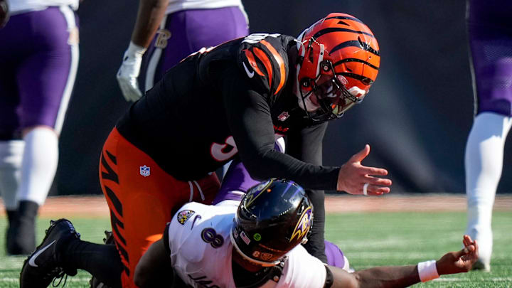 Cincinnati Bengals defensive end Trey Hendrickson (91) gestures to Baltimore Ravens quarterback Lamar Jackson (8) after tackling him in the fourth quarter of the NFL Week 5 game between the Cincinnati Bengals and Baltimore Ravens at Paycor Stadium in downtown Cincinnati on Sunday, Oct. 6, 2024. The Bengals fell to 1-4 on the season with a 41-38 loss to the Ravens.