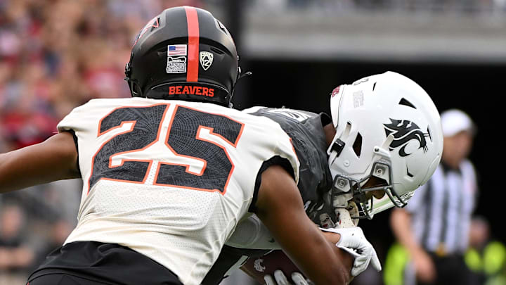 Sep 23, 2023; Pullman, Washington, USA; Oregon State Beavers defensive back Tyrice Ivy Jr. (25) is called for a face mask on Washington State Cougars wide receiver Josh Kelly (3) in the first half at Gesa Field at Martin Stadium. Mandatory Credit: James Snook-Imagn Images