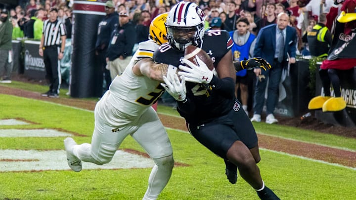 Nov 16, 2024; Columbia, South Carolina, USA; South Carolina Gamecocks tight end Michael Smith (20) makes a touchdown reception as Missouri Tigers linebacker Chuck Hicks (30) defends in the second half at Williams-Brice Stadium. Mandatory Credit: Jeff Blake-Imagn Images