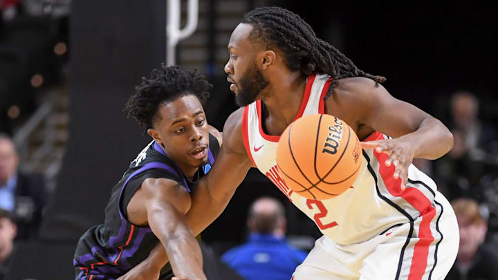 TCU Horned Frogs guard Jayden Pierre (1) defends Ohio State Buckeyes guard Bruce Thornton (2)