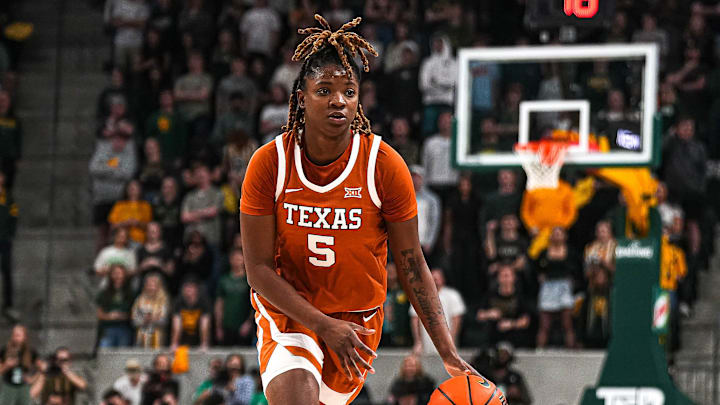 Texas Longhorns forward DeYona Gaston (5) dribbles the ball towards the Baylor basket during the basketball game at the the Foster Pavilion on Thursday, Feb. 1, 2024 in Waco, Texas.