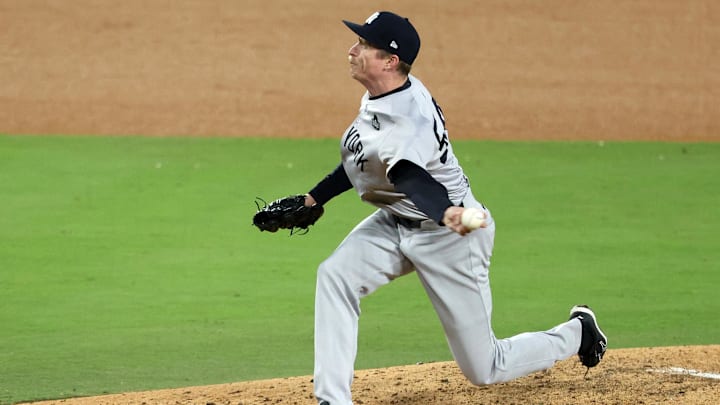 Oct 26, 2024; Los Angeles, California, USA; New York Yankees pitcher Tim Hill (54) throws a pitch against the Los Angeles Dodgers in the sixth inning for game two of the 2024 MLB World Series at Dodger Stadium. 
