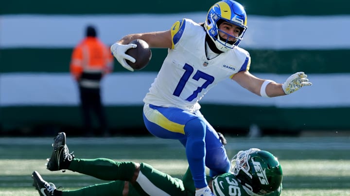 Dec 22, 2024; East Rutherford, New Jersey, USA; New York Jets safety Chuck Clark (36) tackles Los Angeles Rams wide receiver Puka Nacua (17) during the first quarter at MetLife Stadium. Mandatory Credit: Brad Penner-Imagn Images