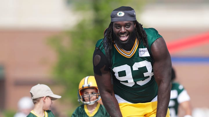 Green Bay Packers defensive lineman Nazir Stackhouse rides a bike to practice at training camp.