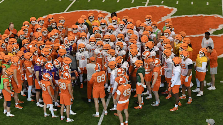 Clemson head coach Dabo Swinney talks with players during the first football practice at the Allen N. Reeves Football Complex at Clemson University in Clemson, S.C. Friday, February 28, 2025.