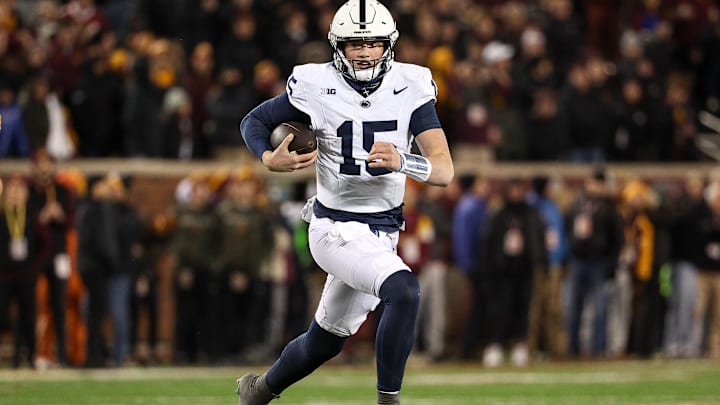 Penn State Nittany Lions quarterback Drew Allar runs the ball against the Minnesota Golden Gophers during the fourth quarter at Huntington Bank Stadium.