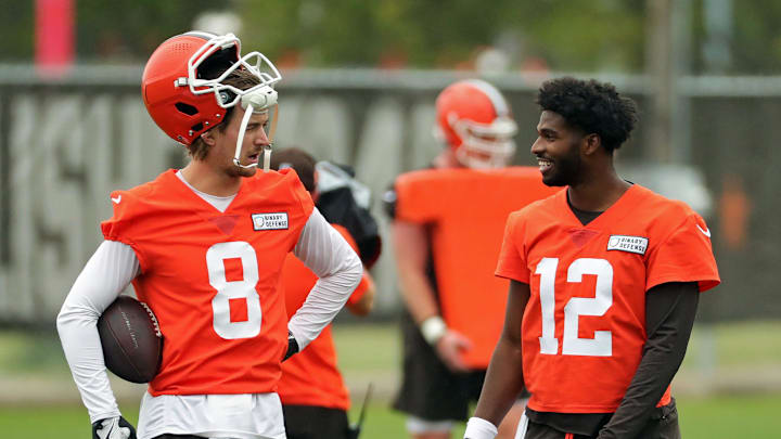 Cleveland Browns quarterback Kenny Pickett, left, chats with quarterback Shedeur Sanders (12) during an NFL practice at the Cleveland Browns training facility on Wednesday, May 28, 2025, in Berea, Ohio.