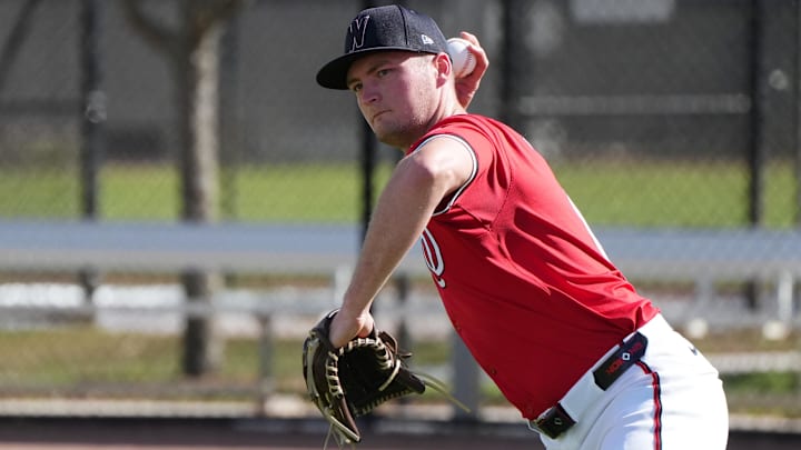 Feb 15, 2025; West Palm Beach, FL, USA; Washington Nationals pitcher Brad Lord (61) takes infield practice during Spring Training. 