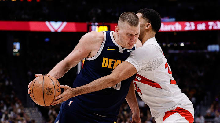 Denver Nuggets center Nikola Jokic (15) is fouled by Toronto Raptors center Jontay Porter (34) in the third quarter at Ball Arena. Mandatory Credit: Isaiah J. Downing-Imagn Images Denver Nuggets center Nikola Jokic (15) is fouled by Toronto Raptors center Jontay Porter (34) in the third quarter at Ball Arena. Mandatory Credit: Isaiah J. Downing-Imagn Images