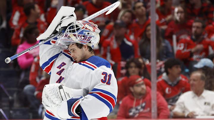 Apr 26, 2024; Washington, District of Columbia, USA; New York Rangers goaltender Igor Shesterkin (31) lifts his mask during a stoppage in play against the Washington Capitals in the second period in game three of the first round of the 2024 Stanley Cup Playoffs at Capital One Arena. Mandatory Credit: Geoff Burke-Imagn Images