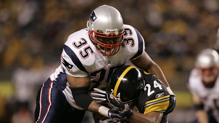 Jan 23, 2005; Pittsburgh, PA, USA; FILE PHOTO;  New England Patriots fullback #35 Patrick Pass tackles Pittsburgh Steelers cornerback #24 during the 2nd quarter of the 2004 AFC Championship Game  at Heinz Field. Mandatory Credit: Matthew Emmons-Imagn Images