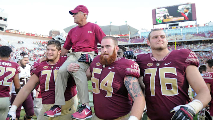 Dec 2, 2017; Tallahassee, FL, USA; Florida State Seminoles offensive line coach Rick Trickett is carried off the field after the game against the Louisiana Monroe Warhawks at Doak Campbell Stadium. 
