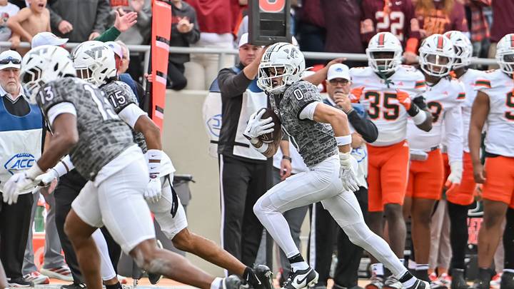 Nov 22, 2025; Blacksburg, Virginia, USA; Virginia Tech Hokies tight end Ja'Ricous Hairston (13) and Virginia Tech Hokies wide receiver Shamarius Peterkin (15) block for Virginia Tech Hokies wide receiver Ayden Greene (0) as he runs after a catch against the Miami (FL) Hurricanes during the third quarter at Lane Stadium. Mandatory Credit: Brian Bishop-Imagn Images Nov 22, 2025; Blacksburg, Virginia, USA; Virginia Tech Hokies tight end Ja'Ricous Hairston (13) and Virginia Tech Hokies wide receiver Shamarius Peterkin (15) block for Virginia Tech Hokies wide receiver Ayden Greene (0) as he runs after a catch against the Miami (FL) Hurricanes during the third quarter at Lane Stadium. Mandatory Credit: Brian Bishop-Imagn Images