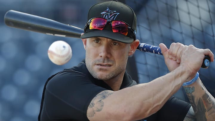 Sep 10, 2024; Pittsburgh, Pennsylvania, USA;  Miami Marlins manager Skip Schumaker (45) hits ground balls during batting practice before a game against the Pittsburgh Pirates at PNC Park. Mandatory Credit: Charles LeClaire-Imagn Images