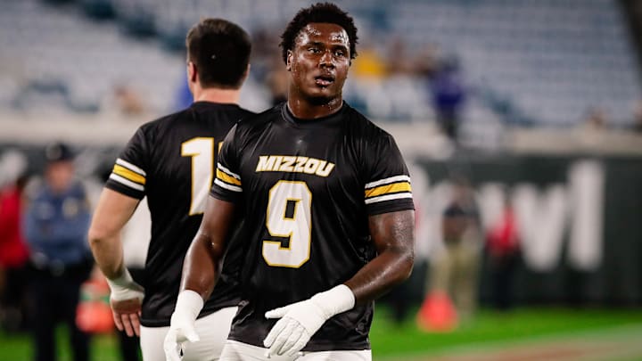 Missouri Tigers defensive end Zion Young (9) warms up before the Gator Bowl against the Virginia Cavaliers at EverBank Stadium. Missouri Tigers defensive end Zion Young (9) warms up before the Gator Bowl against the Virginia Cavaliers at EverBank Stadium.