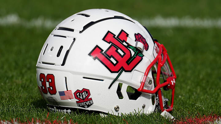 Jan 1, 2022; Pasadena, CA, USA; A Utah Utes football helmet sits on the field with a sticker honoring players Ty Jordan and Aaron Lowe before the 2022 Rose Bowl college football game against the Ohio State Buckeyes at the Rose Bowl. Mandatory Credit: Kirby Lee-Imagn Images Jan 1, 2022; Pasadena, CA, USA; A Utah Utes football helmet sits on the field with a sticker honoring players Ty Jordan and Aaron Lowe before the 2022 Rose Bowl college football game against the Ohio State Buckeyes at the Rose Bowl. Mandatory Credit: Kirby Lee-Imagn Images