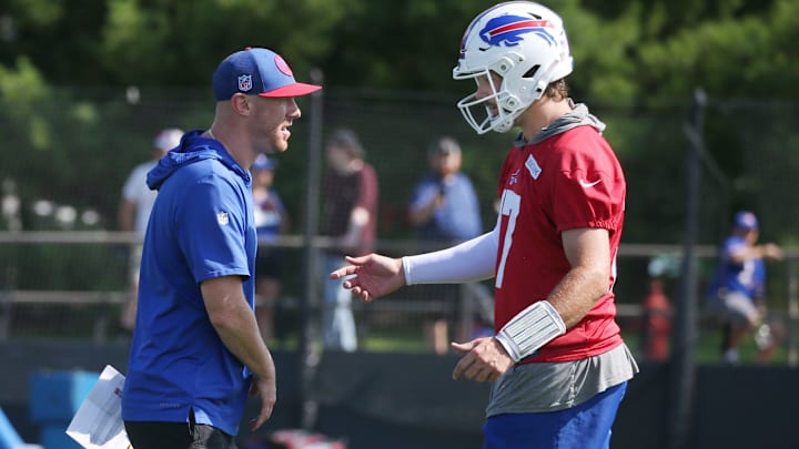Bills quarterback Josh Allen talks with offensive coordinator Joe Brady during drills on day three of training camp.