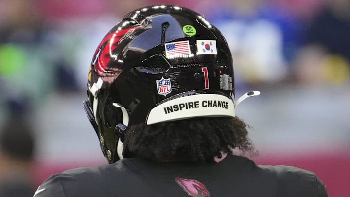Arizona Cardinals quarterback Kyler Murray has both the U.S. and Korean flags on the back of his helmet as he warms up before playing against the Seattle Seahawks at State Farm Stadium in Glendale on Dec. 8, 2024. Murray is one-quarter Korean. Arizona Cardinals quarterback Kyler Murray has both the U.S. and Korean flags on the back of his helmet as he warms up before playing against the Seattle Seahawks at State Farm Stadium in Glendale on Dec. 8, 2024. Murray is one-quarter Korean.