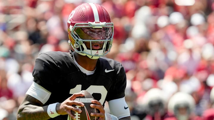 April 11, 2026; Tuscaloosa, AL, USA; Alabama quarterback Keelon Russell rolls out and throws a touchdown pass at Bryant-Denny Stadium during the Alabama A Day scrimmage. April 11, 2026; Tuscaloosa, AL, USA; Alabama quarterback Keelon Russell rolls out and throws a touchdown pass at Bryant-Denny Stadium during the Alabama A Day scrimmage.