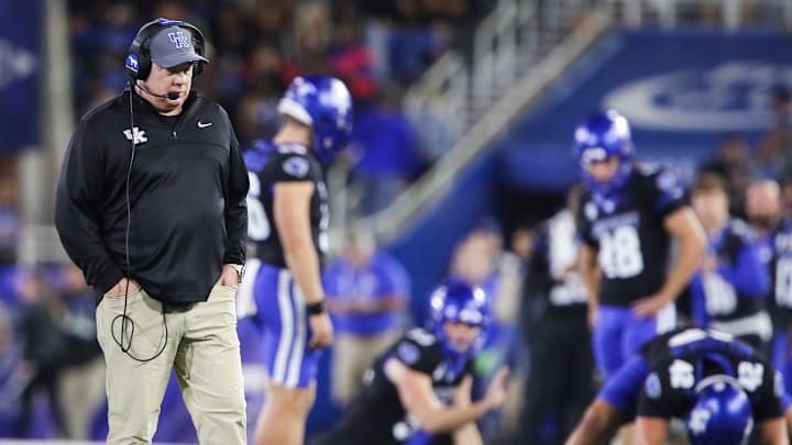 Kentucky head coach Mark Stoops walks the field during a time out as his special teams practice snapping the ball for extra point attempts at Kroger Field Saturday, Oct. 12, 2024 in Lexington, Ky.