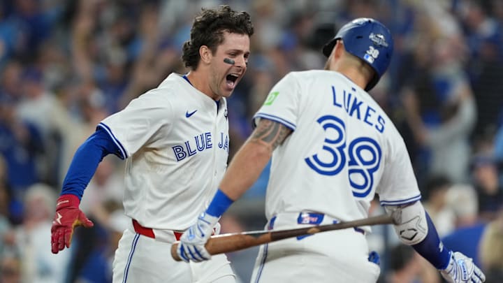 Nov 1, 2025; Toronto, Ontario, CAN; Toronto Blue Jays third baseman Ernie Clement (22) reacts after scoring a run against the Los Angeles Dodgers in the sixth inning for game seven of the 2025 MLB World Series at Rogers Centre. 