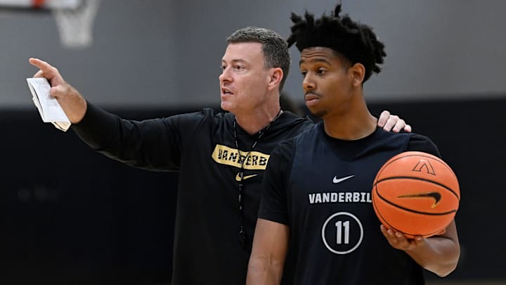 Vanderbilt head coach Mark Byington goes over a drill with guard A.J. Hoggard (11)during an NCAA college basketball practice Tuesday, October 8, 2024, in Nashville, Tenn.