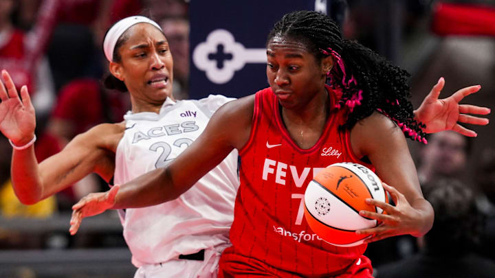Indiana Fever forward Aliyah Boston (7) runs backs into Las Vegas Aces center A'ja Wilson (22) on Wednesday, Sept. 11, 2024, during a game between the Indiana Fever and the Las Vegas Aces at Gainbridge Fieldhouse in Indianapolis. Indiana Fever forward Aliyah Boston (7) runs backs into Las Vegas Aces center A'ja Wilson (22) on Wednesday, Sept. 11, 2024, during a game between the Indiana Fever and the Las Vegas Aces at Gainbridge Fieldhouse in Indianapolis.