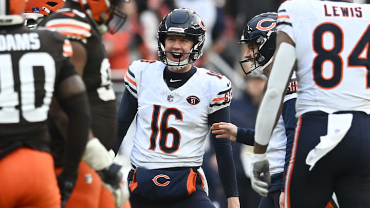Trenton Gill celebrates with kicker Cairo Santos after a field goal by Santos.