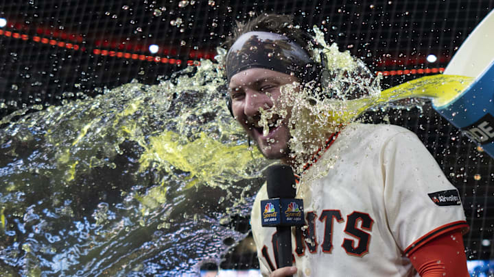Apr 22, 2026: San Francisco Giants catcher Patrick Bailey (14) gets splashed after defeating the Los Angeles Dodgers at Oracle Park. 