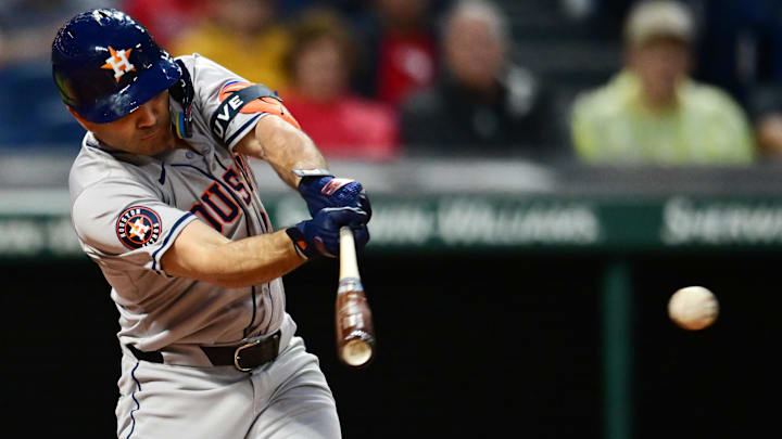 Sep 27, 2024; Cleveland, Ohio, USA; Houston Astros second baseman Jose Altuve (27) hits a double during the first inning against the Cleveland Guardians at Progressive Field. Sep 27, 2024; Cleveland, Ohio, USA; Houston Astros second baseman Jose Altuve (27) hits a double during the first inning against the Cleveland Guardians at Progressive Field.