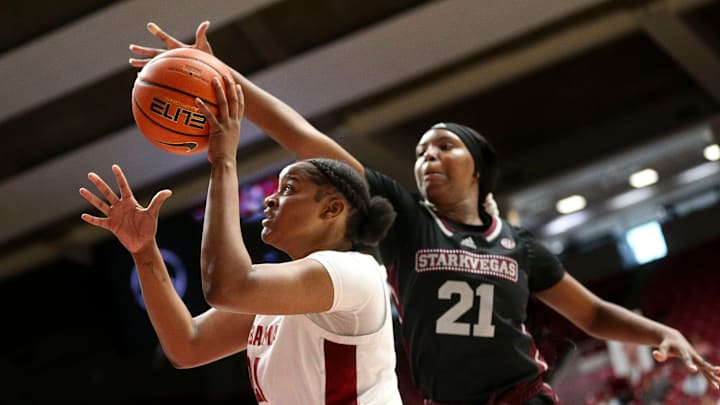 Feb 25, 2024; Tuscaloosa, Alabama, USA; Alabama forward Essence Cody (21) shoots inside with defense by Mississippi State guard Debreasha Powe (21) at Coleman Coliseum Sunday.