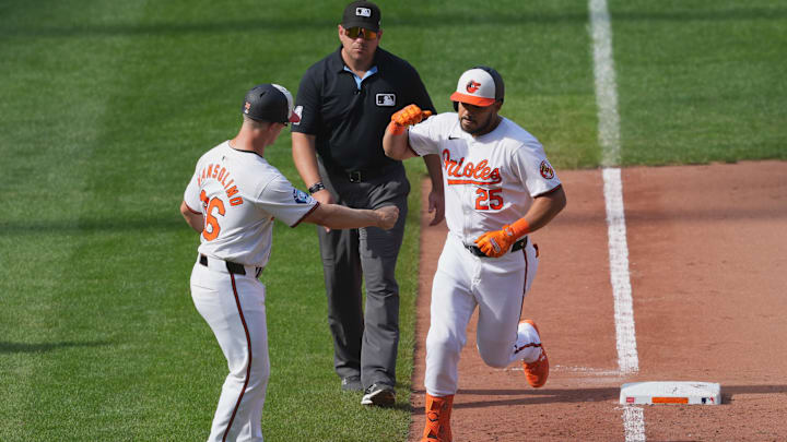 Sep 19, 2024; Baltimore, Maryland, USA; Baltimore Orioles designated hitter Anthony Santander (25) greeted by third base coach Tony Mansolino (36) following his game winning two run home run in the ninth inning against the San Francisco Giants at Oriole Park at Camden Yards. Sep 19, 2024; Baltimore, Maryland, USA; Baltimore Orioles designated hitter Anthony Santander (25) greeted by third base coach Tony Mansolino (36) following his game winning two run home run in the ninth inning against the San Francisco Giants at Oriole Park at Camden Yards.