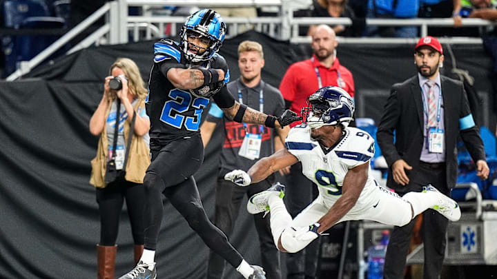 Detroit Lions cornerback Carlton Davis III (23) recovers a fumble and runs against Seattle Seahawks running back Kenneth Walker III (9) during the first half at Ford Field in Detroit on Monday, Sept. 30, 2024. Detroit Lions cornerback Carlton Davis III (23) recovers a fumble and runs against Seattle Seahawks running back Kenneth Walker III (9) during the first half at Ford Field in Detroit on Monday, Sept. 30, 2024.