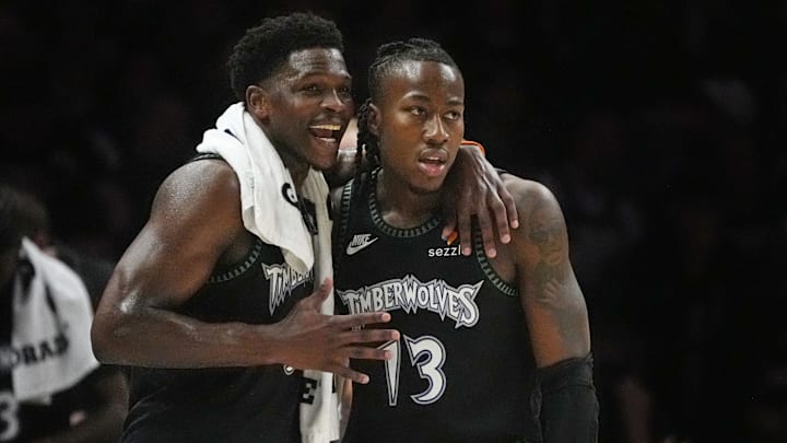 Apr 23, 2026; Minneapolis, Minnesota, USA; Minnesota Timberwolves guard Anthony Edwards (5) talks with guard Ayo Dosunmu (13) during a free throw by the Denver Nuggets in the first quarter at Target Center. Mandatory Credit: Bruce Kluckhohn-Imagn Images