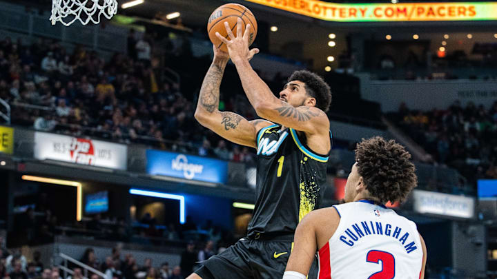 Nov 24, 2023; Indianapolis, Indiana, USA; Indiana Pacers forward Obi Toppin (1) shoots the ball while Cade Cunningham of the Detroit Pistons watches.