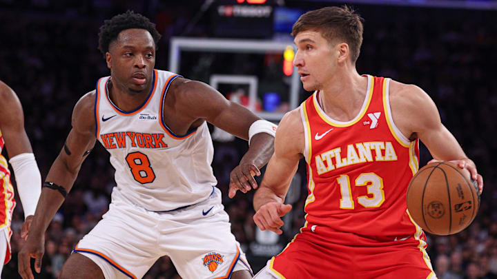 Jan 20, 2025; New York, New York, USA; Atlanta Hawks guard Bogdan Bogdanovic (13) is guarded by New York Knicks forward OG Anunoby (8) during the second half at Madison Square Garden. Mandatory Credit: Vincent Carchietta-Imagn Images