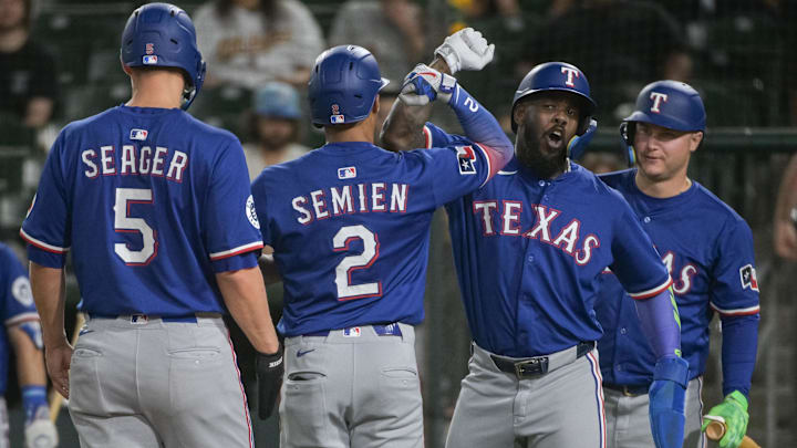 Apr 22, 2025; West Sacramento, California, USA; Texas Rangers second baseman Marcus Semien (2) celebrates with outfielder Adolis García (53) after hitting a home run against the Athletics during the fifth inning at Sutter Health Park. Mandatory Credit: Ed Szczepanski-Imagn Images Apr 22, 2025; West Sacramento, California, USA; Texas Rangers second baseman Marcus Semien (2) celebrates with outfielder Adolis García (53) after hitting a home run against the Athletics during the fifth inning at Sutter Health Park. Mandatory Credit: Ed Szczepanski-Imagn Images
