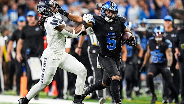 Sep 30, 2024; Detroit, MI, USA; Detroit Lions running back David Montgomery (5) runs for a first down against Seattle Seahawks safety Rayshawn Jenkins (2) during the second half at Ford Field in Detroit on Monday, Sept. 30, 2024. Mandatory Credit: Junfu Han/USA TODAY NETWORK via Imagn Images Sep 30, 2024; Detroit, MI, USA; Detroit Lions running back David Montgomery (5) runs for a first down against Seattle Seahawks safety Rayshawn Jenkins (2) during the second half at Ford Field in Detroit on Monday, Sept. 30, 2024. Mandatory Credit: Junfu Han/USA TODAY NETWORK via Imagn Images
