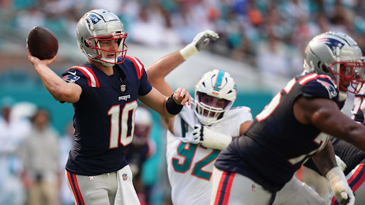 Nov 24, 2024; Miami Gardens, Florida, USA; New England Patriots quarterback Drake Maye (10) attempts a pass against the Miami Dolphins during the first half at Hard Rock Stadium. Mandatory Credit: Jasen Vinlove-Imagn Images