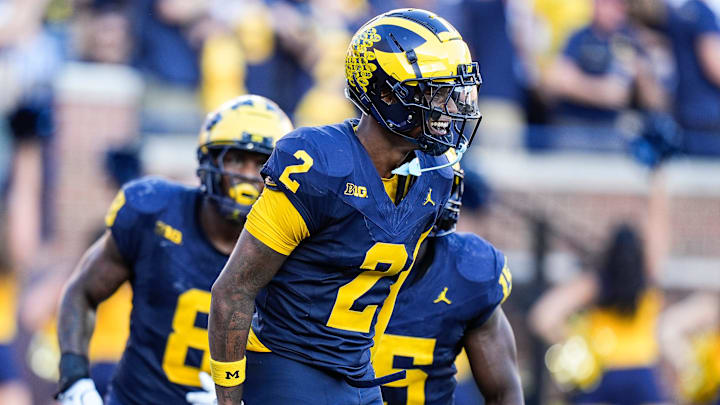 Michigan defensive back Will Johnson (2) celebrates a touchdown after intercepting USC quarterback Miller Moss (7) during the second half at Michigan Stadium in Ann Arbor on Saturday, Sept. 21, 2024.