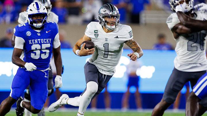 Sep 13, 2025; Lexington, Kentucky, USA; Eastern Michigan Eagles quarterback Noah Kim (1) runs the ball during the third quarter against the Kentucky Wildcats at Kroger Field. Mandatory Credit: Jordan Prather-Imagn Images