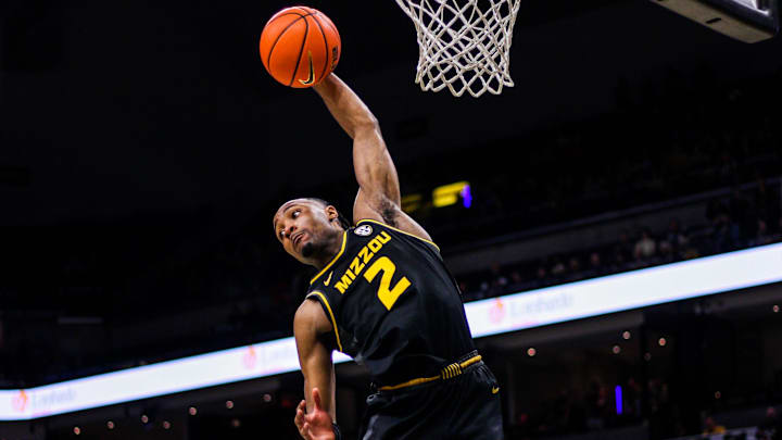Missouri's Tamar Bates reaches up for a rebound during a college basketball game against Ole Miss at Mizzou Arena on Mar. 2, 2024, in Columbia, Mo. Missouri's Tamar Bates reaches up for a rebound during a college basketball game against Ole Miss at Mizzou Arena on Mar. 2, 2024, in Columbia, Mo.