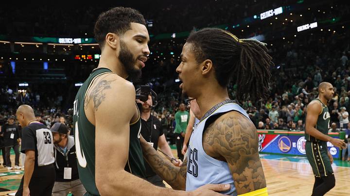 Feb 12, 2023; Boston, Massachusetts, USA; Boston Celtics forward Jayson Tatum (0) and Memphis Grizzlies guard Ja Morant (12) talks after the Celtics win at TD Garden. Mandatory Credit: Winslow Townson-Imagn Images