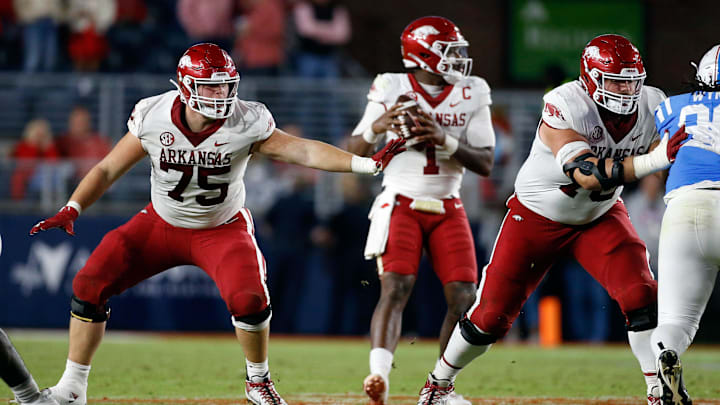 Oct 7, 2023; Oxford, Mississippi, USA; Arkansas Razorbacks offensive linemen Patrick Kutas (75) and Arkansas Razorbacks offensive linemen Joshua Braun (78) block during the second half against the Mississippi Rebels at Vaught-Hemingway Stadium. Mandatory Credit: Petre Thomas-Imagn Images