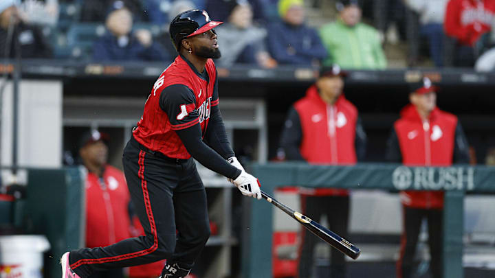 May 23, 2025; Chicago, Illinois, USA; Chicago White Sox center fielder Luis Robert Jr. (88) hits an RBI-single against the Texas Rangers during the third inning at Rate Field. Mandatory Credit: Kamil Krzaczynski-Imagn Images