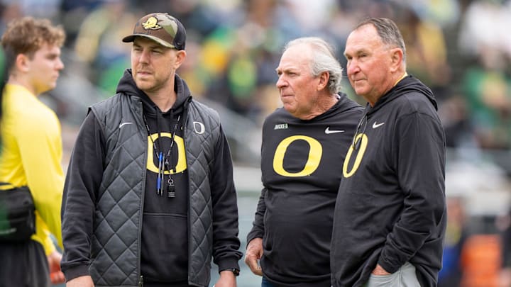 Oregon offensive coordinator Will Stein, left, former Oregon defensive coordinator Nick Aliotti and former Oregon coach Rich Brooks talk before the game as the Fighting Ducks face off against Mighty Oregon in the Oregon Ducks spring game on April 26, 2025, at Autzen Stadium in Eugene. Oregon offensive coordinator Will Stein, left, former Oregon defensive coordinator Nick Aliotti and former Oregon coach Rich Brooks talk before the game as the Fighting Ducks face off against Mighty Oregon in the Oregon Ducks spring game on April 26, 2025, at Autzen Stadium in Eugene.