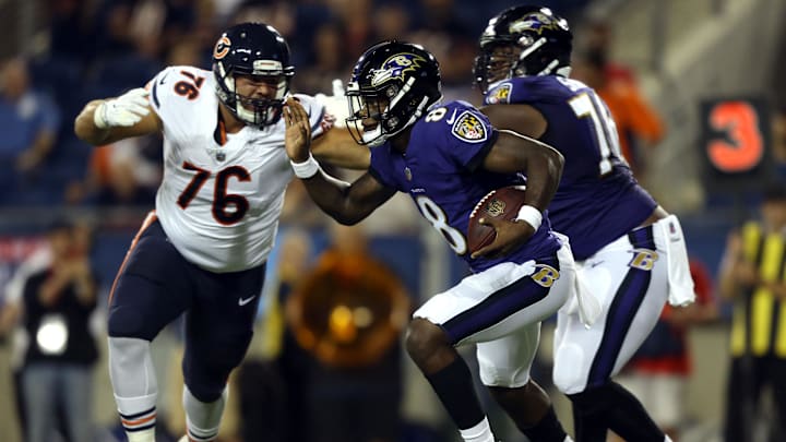 Lamar Jackson scrambles against the Bears in his first-ever preseason game.  The Bears have never faced him in the regular season.
